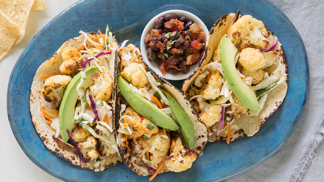 Cauliflower tacos on w plate with salsa.