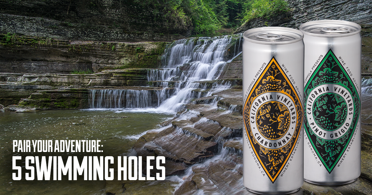 Waterfall with Diamond Collection Chardonnay and Pinot Grigio cans of wine.