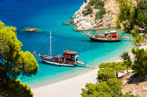Boats on the shoreline of Karpathos, Greece.