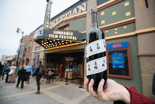 A Sundance Film Festival marquee with a bottle of Director's Cut Cabernet Sauvignon held up in front of it.